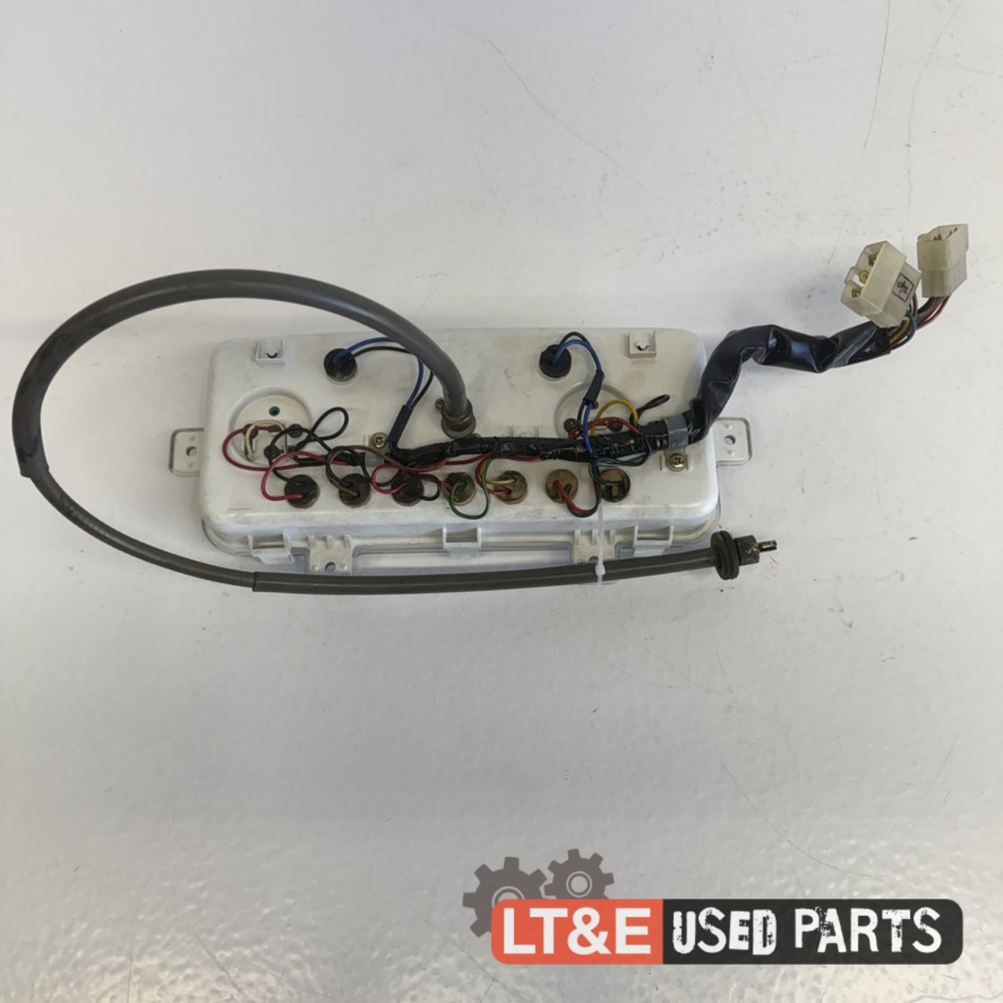 INSTRUMENT CLUSTER WITH TACH CABLE